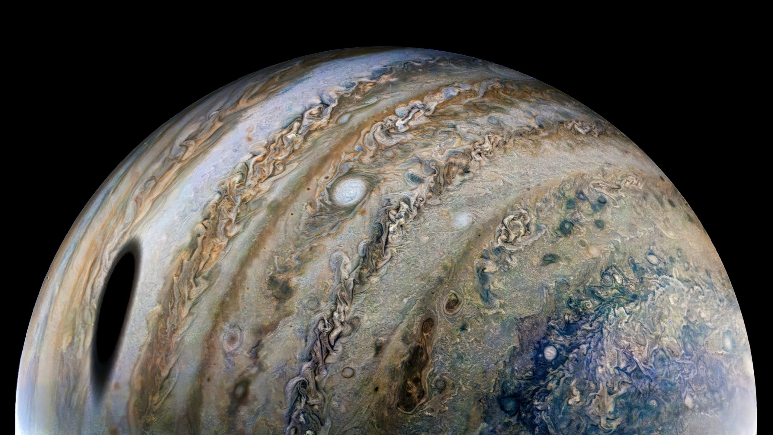 Ganymede casts a massive shadow across Jupiter in a stunning new image from NASA’s Juno spacecraft